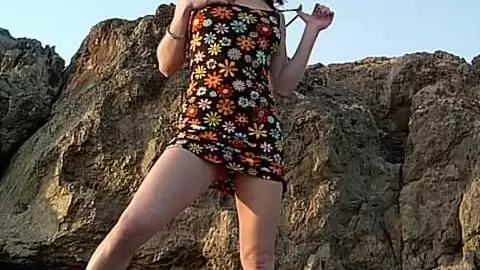 La encantadora joven morena julie se desnuda junto al mar photo 5