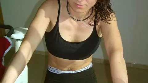 Brunette teen slut gets all sweaty and strips in the gym photo 2