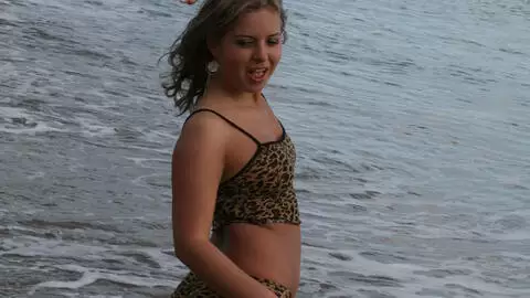 Teen exhibs at the beach photo 2